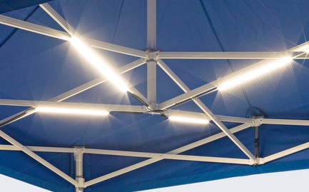 LED lighting system mounted on the internal trusses of a blue Mastertent event tent.