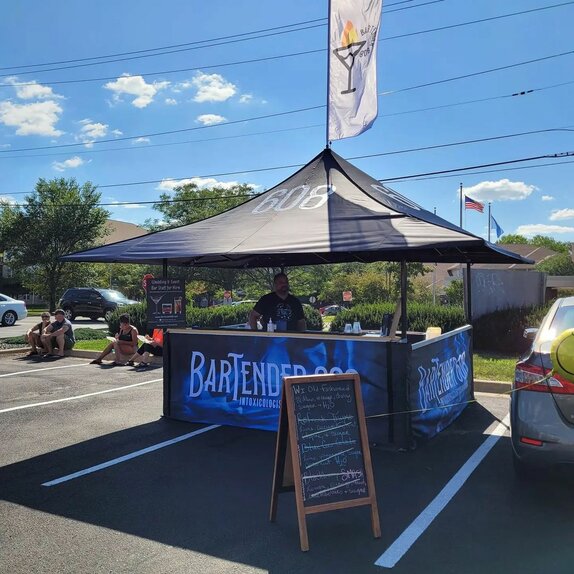 A custom printed 13x13 ft canopy tent with tent accessories.