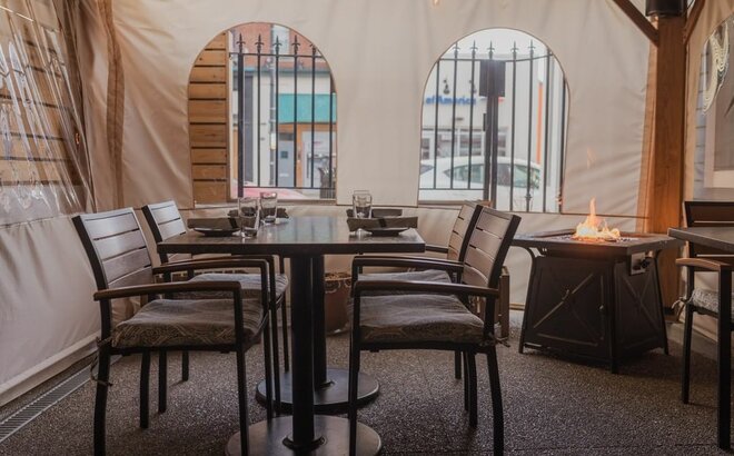 Mastertent ecru window sidewalls enclosing an outdoor dining space at Fig & Ash restaurant. 