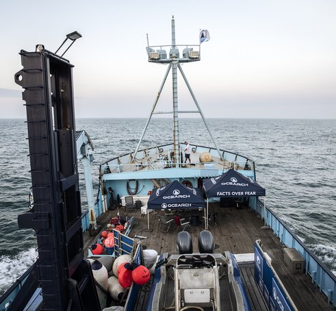 Two Mastertent canopy tents on the deck of a large Ocearch company boat going out to sea.