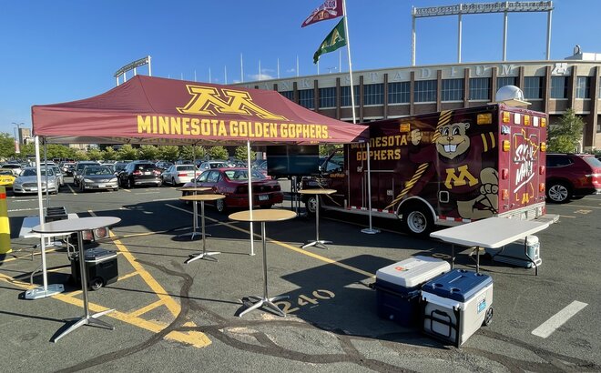 A tailgate tent by Mastertent branded for the Minnesota Golden Gophers.