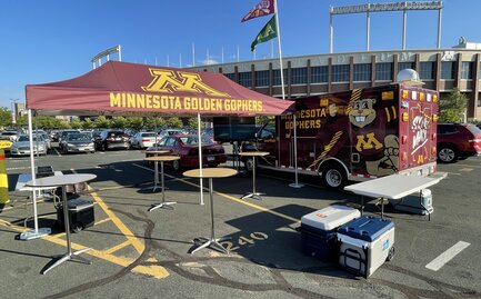 A tailgate tent by Mastertent branded for the Minnesota Golden Gophers.