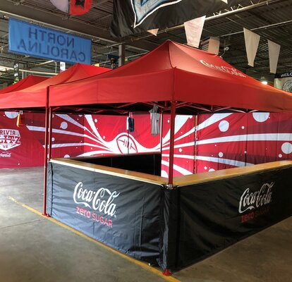 Three 15x10 promotional and marketing tents connected together have sidewalls, custom tent frame colors, and tent counters. 