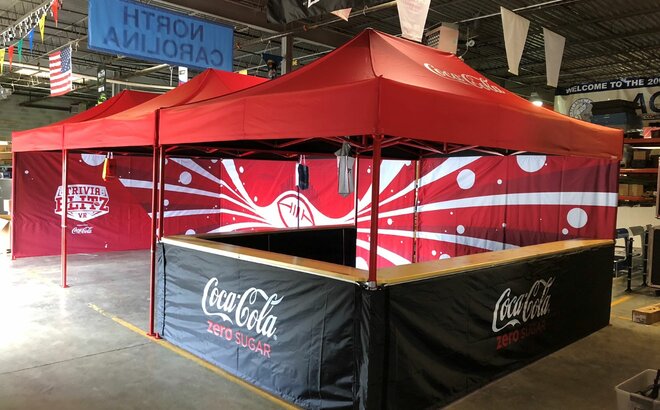 Three 15x10 promotional and marketing tents connected together have sidewalls, custom tent frame colors, and tent counters. 