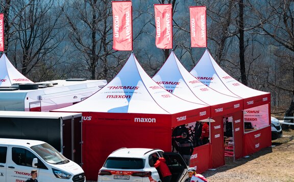 3 custom 17x17 mountain biking team tents with peak flags and custom sidewalls.   