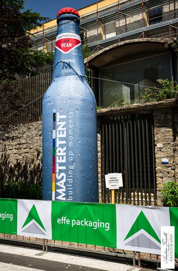 Custom Mastertent branded bottle inflatable at bike race. 