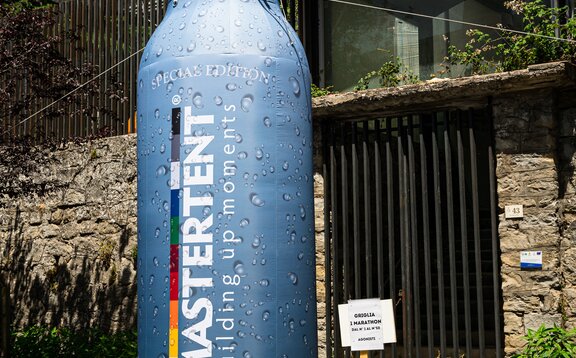 Custom Mastertent branded bottle inflatable at bike race. 