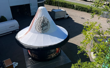 Overhead view of custom printed beer pint on Mastertent Tripod inflatable structure.