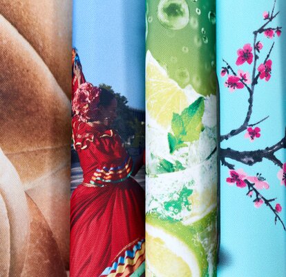 Close up of six printed pieces of fabric curved and stacked horizontally