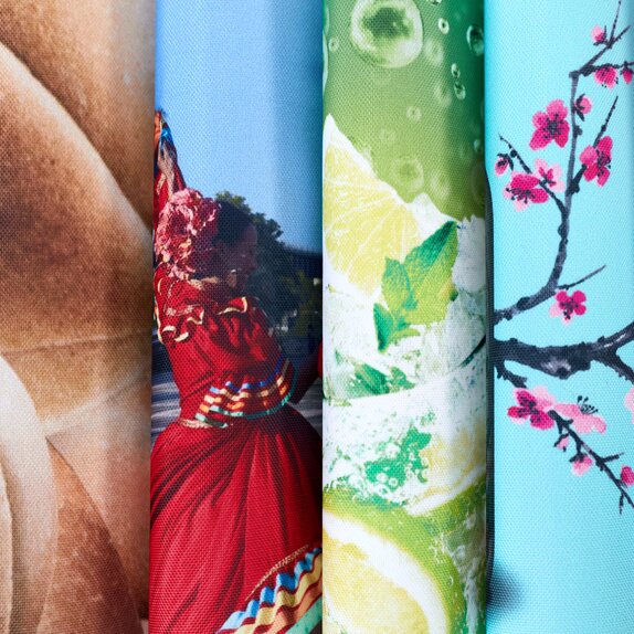 Close up of six printed pieces of fabric curved and stacked horizontally