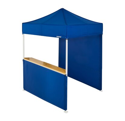 A blue 6.5x6.5ft Mastertent with two blue fabric sidewalls. One sidewall is closed and one is a half-height with a wooden counter. 