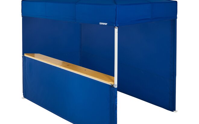 A blue 10x6.5ft Mastertent with three blue fabric sidewalls. Two sidewalls are closed and one is a half-height with a wooden counter. 
