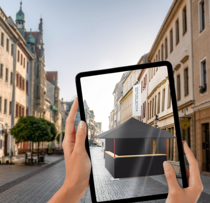 Configuration of a folding pavilion displayed on a tablet as a visualization in a city center