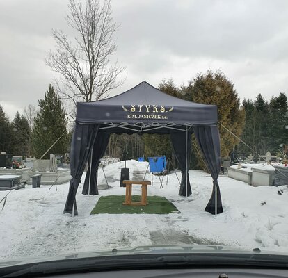 A black canopy tent for funerals.