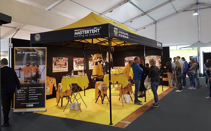 Gazebo 6x3 for trade fair. Yellow and black gazebo customised with HC Pustertal team logo.  