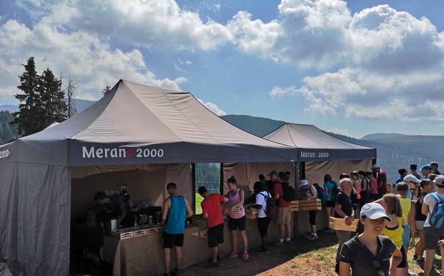 Gray 6x4 folding gazebo with side walls and Merano 2000 logo for mountain run refreshment station